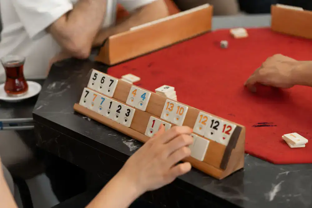 Group of friends playing board games at a reserved table