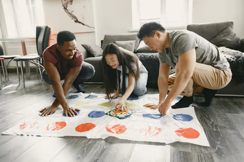 A lively group of friends cheering during a board game session
