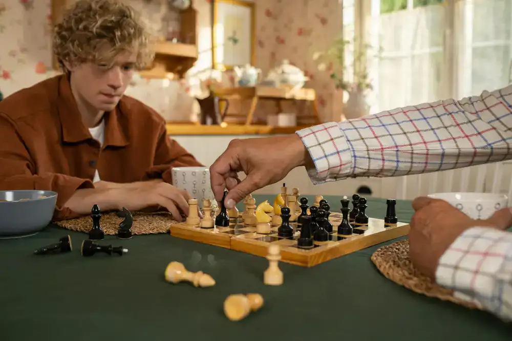 People learning a new board game together
